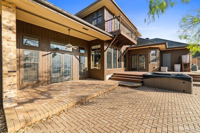 4301 Spring Creek Dr, Corpus Christi, TX 78410 - back of house with a balcony, a covered hot tub, french doors, and a patio