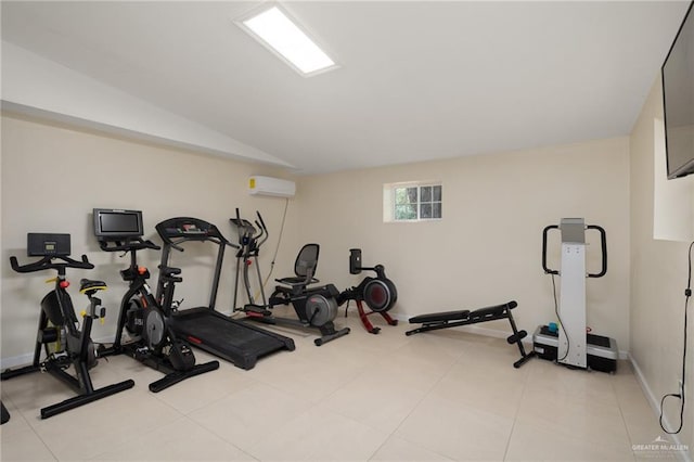 workout room with light tile patterned flooring, lofted ceiling, and a wall unit AC