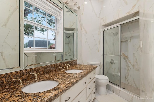 bathroom featuring vanity, an enclosed shower, and toilet