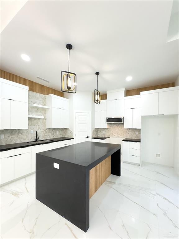 kitchen featuring marble finish floor, modern cabinets, and open shelves