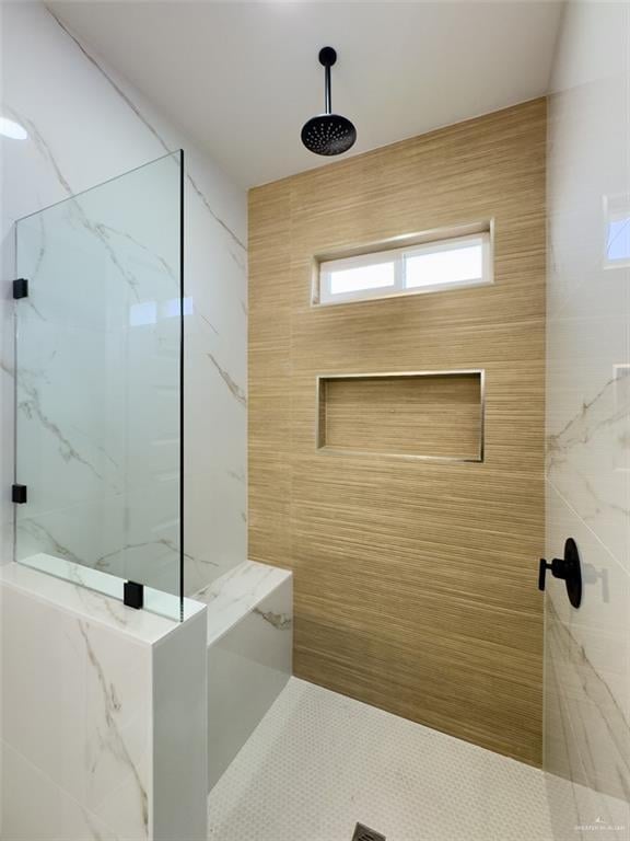 bathroom with a marble finish shower