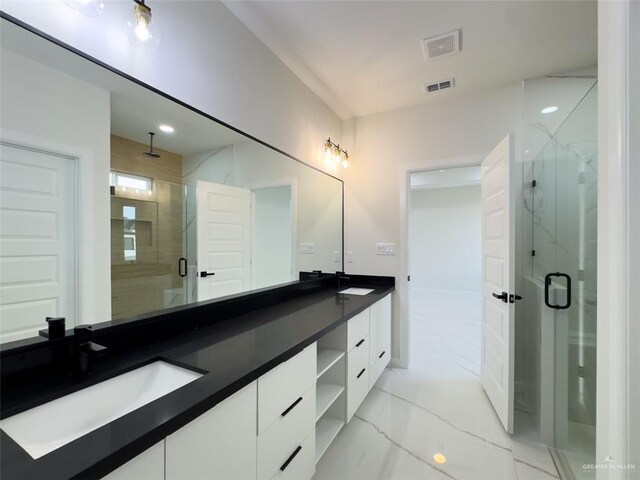 bathroom featuring visible vents, marble finish floor, a sink, a marble finish shower, and double vanity