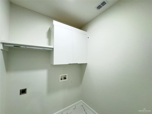 clothes washing area featuring electric dryer hookup, visible vents, marble finish floor, cabinet space, and hookup for a washing machine