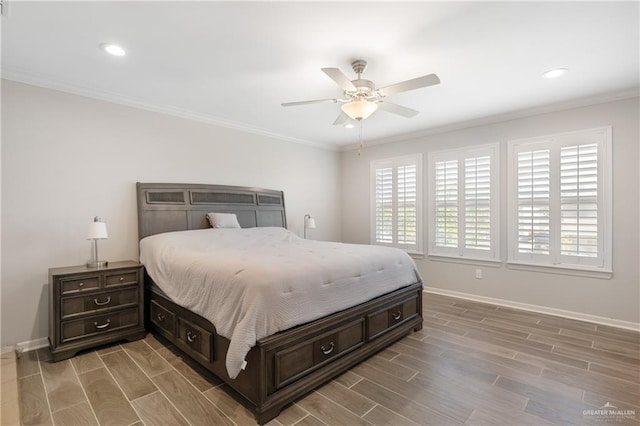 bedroom featuring ornamental molding, wood finish floors, and multiple windows