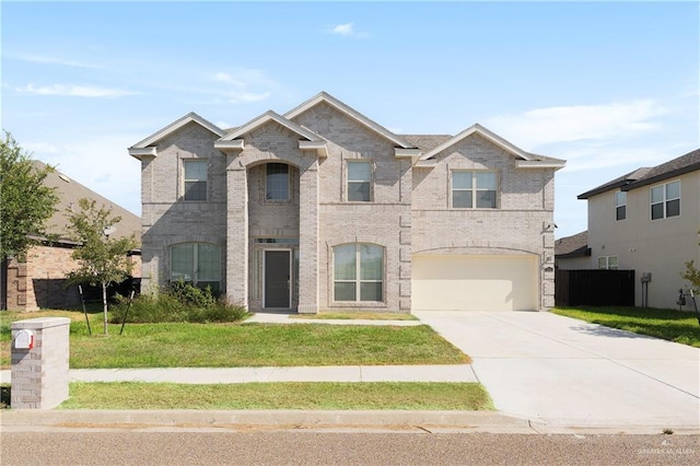 view of front of property featuring a front yard, brick siding, concrete driveway, and an attached garage