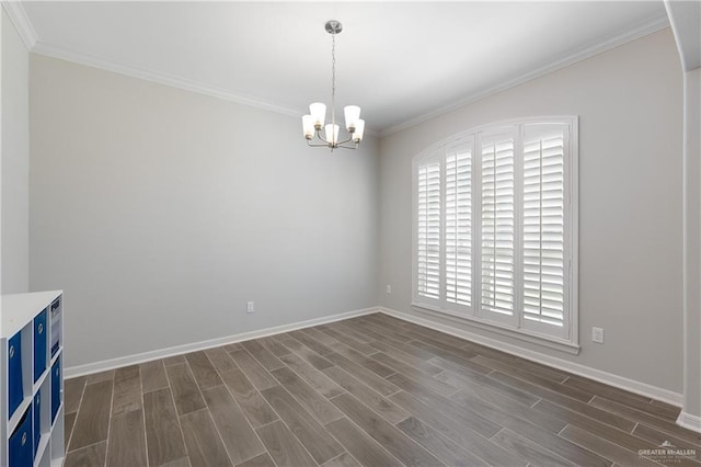 empty room featuring baseboards, dark wood-style flooring, ornamental molding, and a chandelier