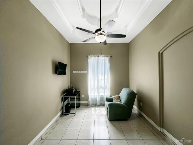 700 Via Cantera Dr, San Juan, TX 78589 - sitting room featuring a tray ceiling, a ceiling fan, light tile patterned floors, and baseboards