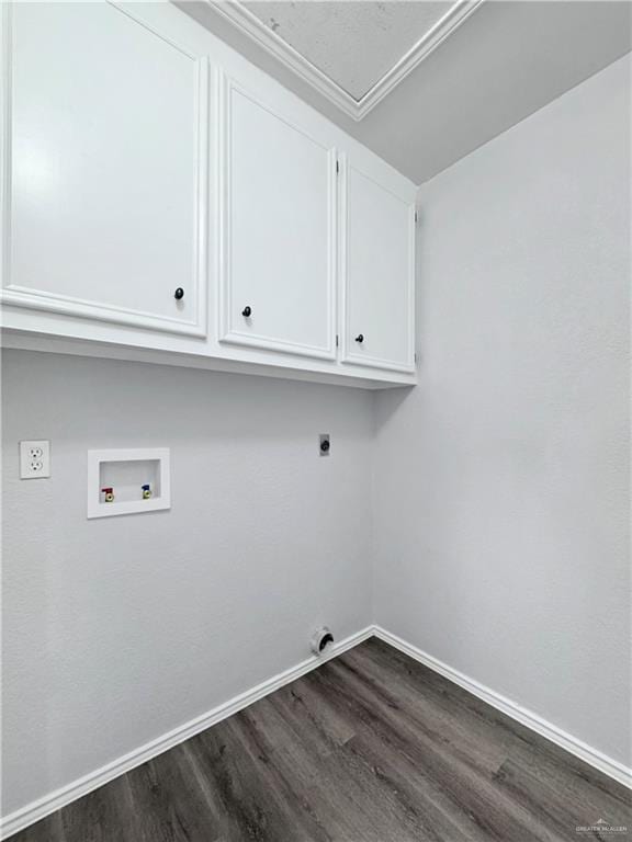 laundry room featuring hookup for a washing machine, dark hardwood / wood-style floors, cabinets, and hookup for an electric dryer