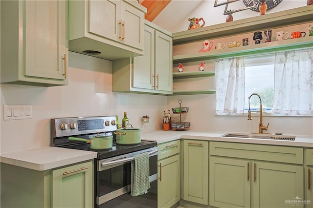 kitchen with sink, stainless steel range with electric cooktop, and green cabinets