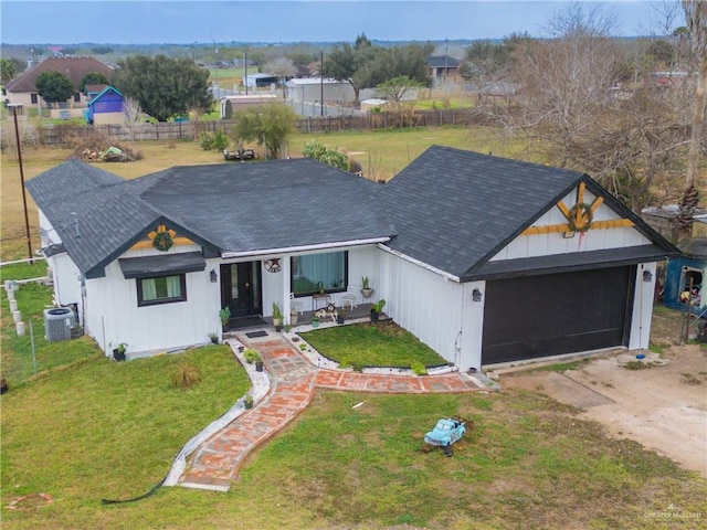 modern farmhouse with a garage, central AC, and a front yard