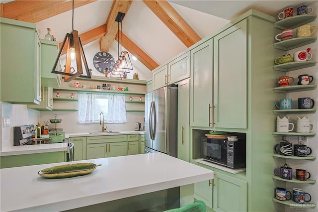 kitchen featuring appliances with stainless steel finishes, sink, green cabinets, and hanging light fixtures