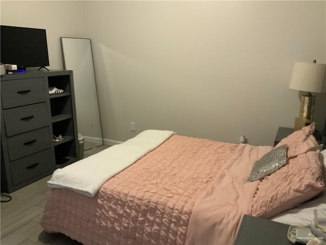 bedroom with light wood-type flooring