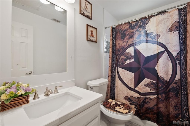 bathroom with vanity and toilet