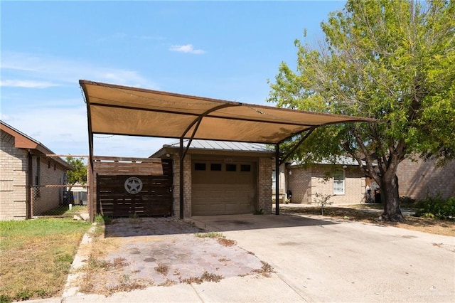 view of front of home with a carport, a garage, and an outbuilding