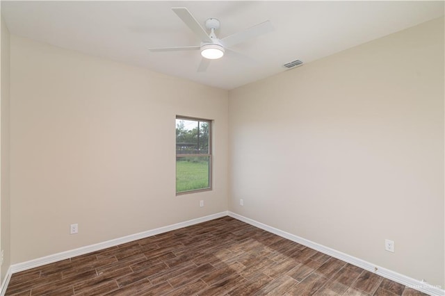 unfurnished room with dark wood-type flooring and ceiling fan