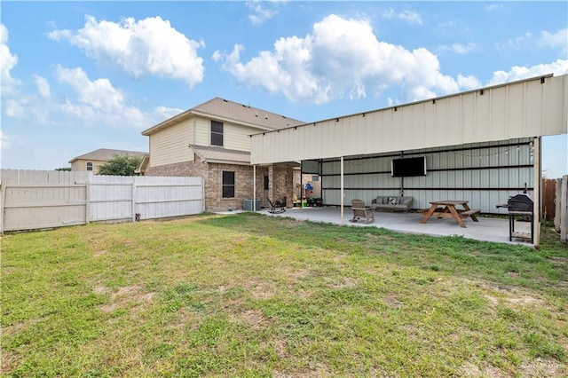1041 Yellow Hammer St, Rio Grande City, TX 78582 - rear view of property with a patio, central AC, and brick siding