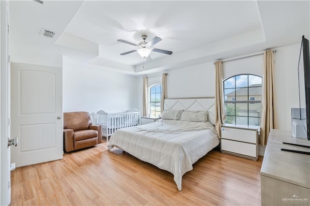 1041 Yellow Hammer St, Rio Grande City, TX 78582 - bedroom with a raised ceiling, light wood finished floors, and ceiling fan