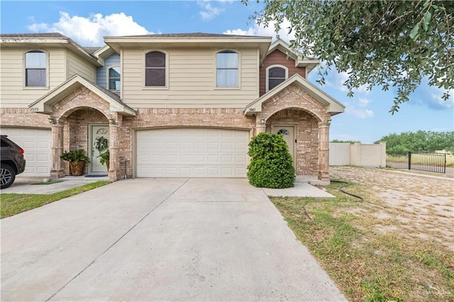 1041 Yellow Hammer St, Rio Grande City, TX 78582 - traditional home with an attached garage, brick siding, and concrete driveway