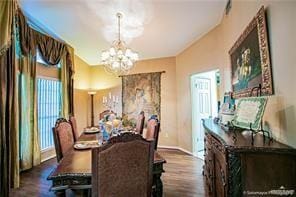 dining room featuring dark hardwood / wood-style floors and a notable chandelier