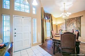 entrance foyer featuring a notable chandelier and light wood-type flooring