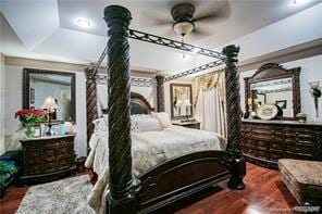 bedroom with ceiling fan and wood-type flooring