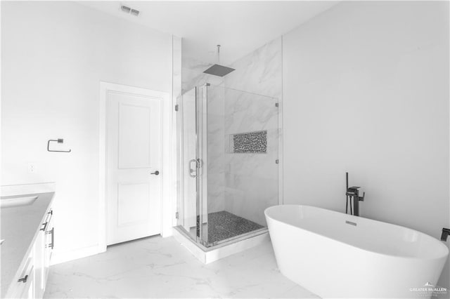 bathroom featuring vanity and separate shower and tub