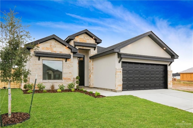 view of front facade with a garage and a front lawn