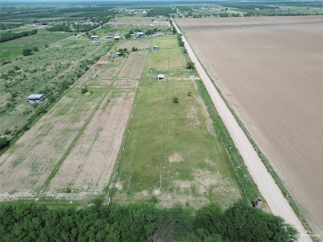 birds eye view of property with a rural view