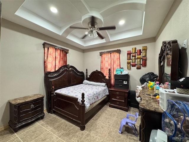 bedroom featuring ceiling fan, light tile patterned floors, and coffered ceiling