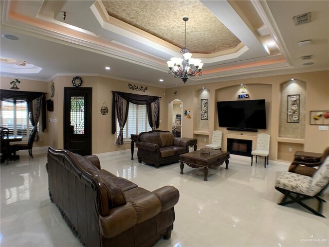 living area featuring a raised ceiling, a notable chandelier, arched walkways, and crown molding