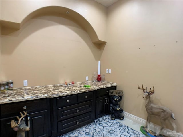 interior space featuring baseboards
