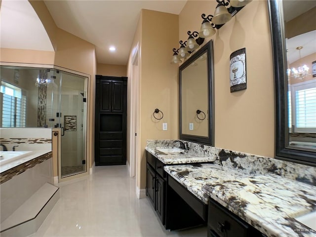 full bath featuring a shower stall, vanity, a bath, tile patterned floors, and baseboards