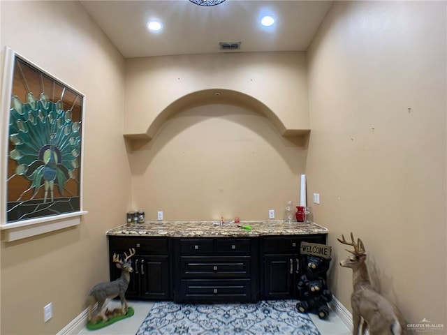 interior space with baseboards and visible vents