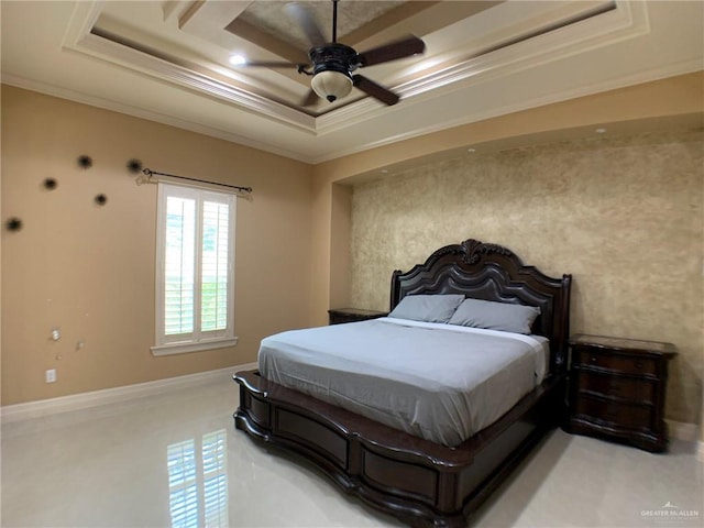 bedroom featuring a raised ceiling, crown molding, and a ceiling fan