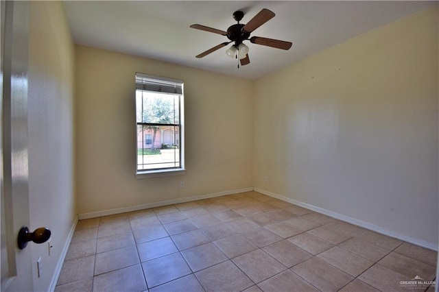 unfurnished room featuring light tile patterned floors and ceiling fan