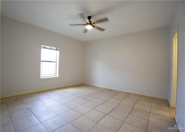 tiled empty room with ceiling fan