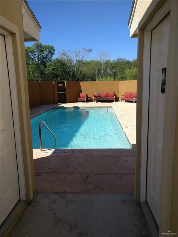 view of pool featuring an outdoor living space and a patio