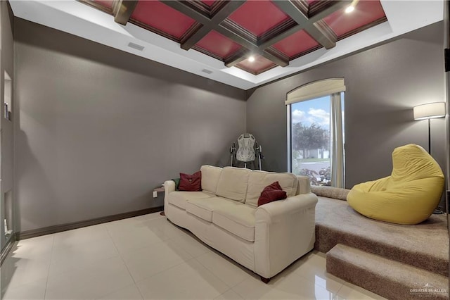 living room with beamed ceiling, coffered ceiling, and light tile patterned floors