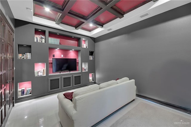 tiled cinema featuring coffered ceiling, crown molding, built in features, and beamed ceiling