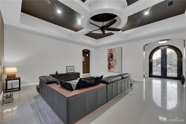 interior space featuring french doors, ceiling fan, and coffered ceiling