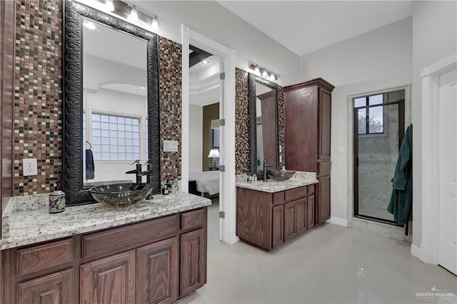 bathroom featuring vanity, tile patterned flooring, and a wealth of natural light