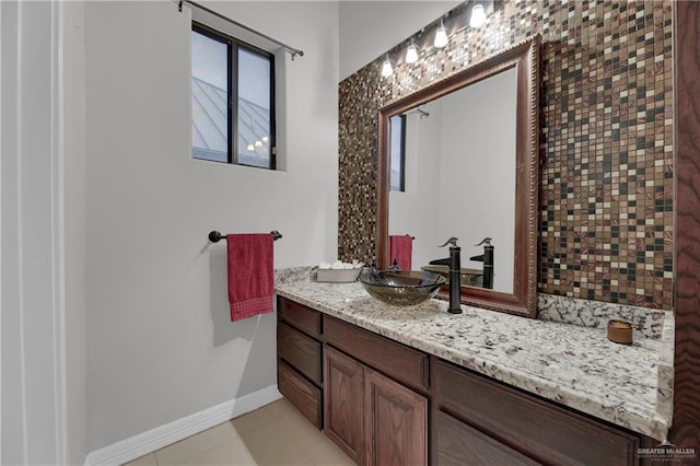 bathroom with tile patterned flooring and vanity