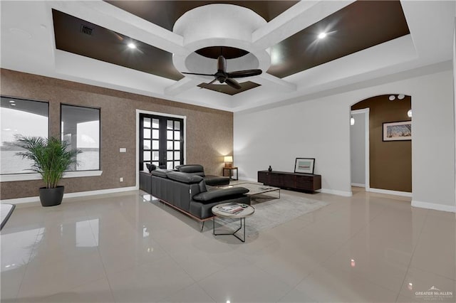 living room featuring french doors and ceiling fan