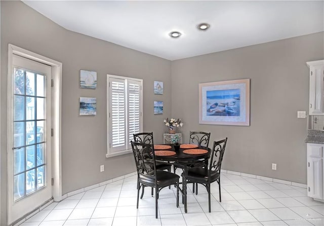dining area featuring baseboards