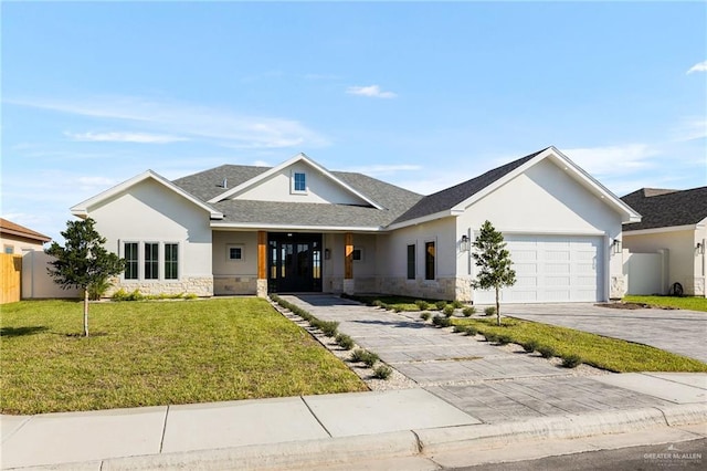 view of front of property with a garage and a front yard