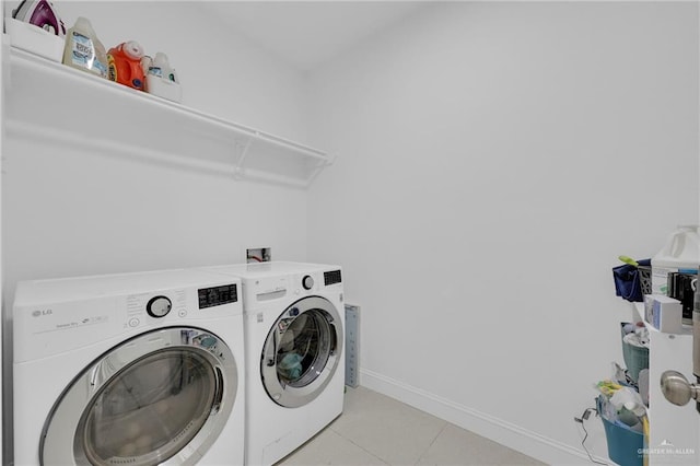 2800 Santa Lydia St, Mission, TX 78572 - laundry area with washer and dryer, light tile patterned flooring, and baseboards