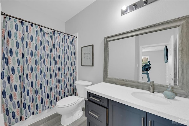 2800 Santa Lydia St, Mission, TX 78572 - full bath with vanity, toilet, a shower with curtain, and wood finished floors