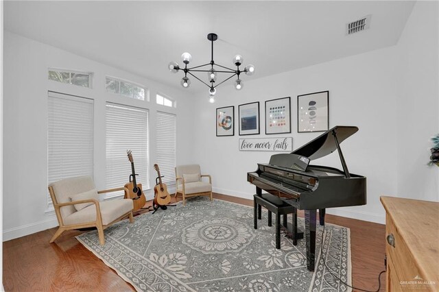2800 Santa Lydia St, Mission, TX 78572 - sitting room featuring a chandelier, wood finished floors, and baseboards