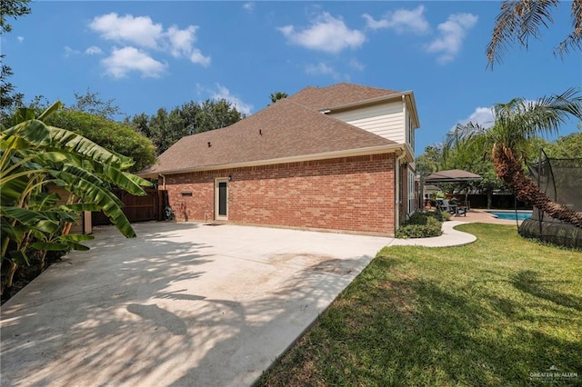 2800 Santa Lydia St, Mission, TX 78572 - view of property exterior with brick siding, a patio, an outdoor pool, and roof with shingles