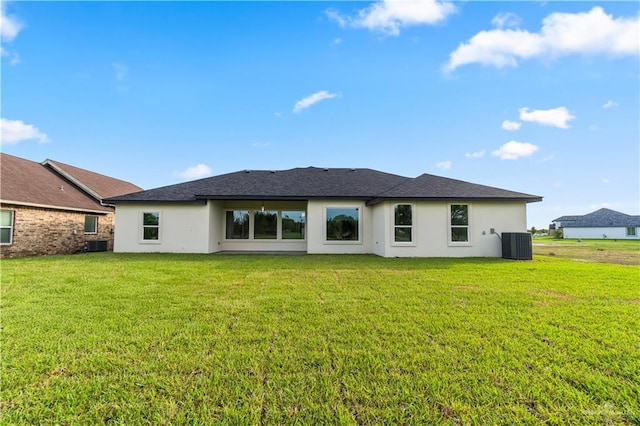 1114 Knotty Pine Ln, Harlingen, TX 78552 - back of property featuring stucco siding and a yard